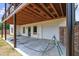 An outdoor view of the home features a spacious garage and covered outdoor space at 1423 Hillcrest Rd, Bowdon, GA 30108