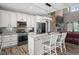Bright and modern kitchen with white cabinets, granite countertops, and stainless steel appliances at 1423 Hillcrest Rd, Bowdon, GA 30108
