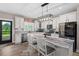 Modern kitchen featuring a large island, stainless steel appliances, and plenty of counter space at 1423 Hillcrest Rd, Bowdon, GA 30108