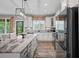 Well-equipped kitchen with an island, stainless steel appliances, and outdoor access at 1423 Hillcrest Rd, Bowdon, GA 30108