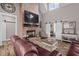 Inviting living room with a brick fireplace, large TV, and comfortable leather furniture at 1423 Hillcrest Rd, Bowdon, GA 30108