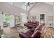 Spacious living room with vaulted ceilings, wood floors, and comfortable leather seating at 1423 Hillcrest Rd, Bowdon, GA 30108