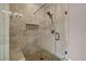 Tiled shower with a glass enclosure, built-in bench, and decorative niche at 1423 Hillcrest Rd, Bowdon, GA 30108