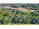 Stunning aerial shot of land by the lake surrounded by mature trees, ready for your dream home at 2237 Walt Stephens Rd, Jonesboro, GA 30236
