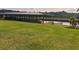Covered boat dock on Lake Spivey with well-maintained lawn at 2237 Walt Stephens Rd, Jonesboro, GA 30236