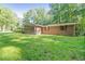 This brick home features a sunroom and a patio, perfect for relaxing and enjoying the outdoors at 2237 Walt Stephens Rd, Jonesboro, GA 30236