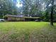 Traditional brick home nestled in a wooded lot with a spacious front yard at 2237 Walt Stephens Rd, Jonesboro, GA 30236