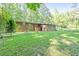 Brick home has a spacious yard and inviting outdoor space for entertaining and relaxation at 2237 Walt Stephens Rd, Jonesboro, GA 30236