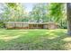 Charming single-story brick home with a spacious yard, perfect for outdoor activities and relaxation at 2237 Walt Stephens Rd, Jonesboro, GA 30236