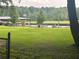 Scenic Lake Spivey view, featuring a dock and boat house at 2237 Walt Stephens Rd, Jonesboro, GA 30236