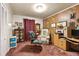 Functional home office with wood paneling, built-in shelving, and a comfortable workspace at 2237 Walt Stephens Rd, Jonesboro, GA 30236