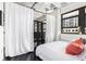 Bright bedroom featuring a window, partial partition, and comfortable bedding and decor at 878 Peachtree Ne St # 634, Atlanta, GA 30309