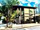 Modern building with glass windows, a peaked overhang, and unique signage, surrounded by lush trees at 878 Peachtree Ne St # 634, Atlanta, GA 30309