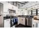 Bright kitchen showcasing stainless steel appliances, sleek countertops, and modern white cabinetry at 878 Peachtree Ne St # 634, Atlanta, GA 30309