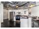 Contemporary kitchen featuring white cabinets, stainless steel appliances, and a breakfast bar area at 878 Peachtree Ne St # 634, Atlanta, GA 30309