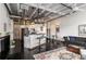 Open floor plan featuring a kitchen area with breakfast bar and living space with seating and decor at 878 Peachtree Ne St # 634, Atlanta, GA 30309