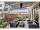 Charming outdoor patio with modern furniture, a privacy fence, and lush greenery at 878 Peachtree Ne St # 634, Atlanta, GA 30309