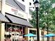 A street view of Vinny's N.Y. Pizza, highlighting the property's convenient access to local dining options at 878 Peachtree Ne St # 634, Atlanta, GA 30309
