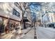 A street view showcasing the building's exterior with large storefront windows and proximity to city amenities and retail at 878 Peachtree Ne St # 634, Atlanta, GA 30309