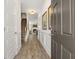 Inviting hallway featuring wood floors, decorative wainscoting, and access to the main living area at 1125 Elowen Dr, Austell, GA 30168