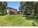 Large backyard with a spacious lawn and two-story deck for relaxing at 1956 Spencer Oaks Ln, Lithonia, GA 30058