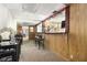The home features a basement bar with wood paneling, stools, and a mirrored backsplash for entertainment at 1956 Spencer Oaks Ln, Lithonia, GA 30058