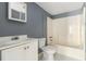 This bathroom has a tiled floor, white vanity, toilet, and shower/tub combo at 1956 Spencer Oaks Ln, Lithonia, GA 30058