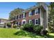 Charming two-story brick home with black shutters and a well-manicured lawn at 1956 Spencer Oaks Ln, Lithonia, GA 30058
