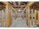 Unfinished basement featuring concrete floor, exposed framing, and ample space for customization at 2370 Burch Cir, Brookhaven, GA 30319