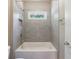 Tiled bathroom with combo tub and shower at 2370 Burch Cir, Brookhaven, GA 30319