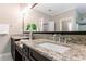 Bathroom with granite countertop, undermount sink, and decorative mirror at 2370 Burch Cir, Brookhaven, GA 30319