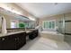 Bright bathroom with tile floors, double vanity, large soaking tub, and frameless glass shower at 2370 Burch Cir, Brookhaven, GA 30319