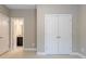 Neutral bedroom featuring an ensuite bathroom and a double door closet at 2370 Burch Cir, Brookhaven, GA 30319