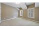 Angled bedroom featuring two windows and plush carpeting at 2370 Burch Cir, Brookhaven, GA 30319