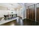 Dining room with modern decor, wainscoting, and a view of the front door, showcasing the home's design at 2370 Burch Cir, Brookhaven, GA 30319