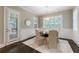 Cozy dining room with wainscoting, natural light, access to backyard deck and hardwood floors at 2370 Burch Cir, Brookhaven, GA 30319