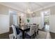 Bright dining room featuring modern wainscoting and access to the foyer and kitchen area at 2370 Burch Cir, Brookhaven, GA 30319