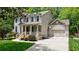Beautiful two-story home with a covered front porch, attached garage, and meticulously maintained landscaping at 2370 Burch Cir, Brookhaven, GA 30319