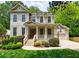 Charming two-story home with a welcoming front porch and manicured landscaping at 2370 Burch Cir, Brookhaven, GA 30319