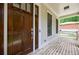 Inviting front porch with brick flooring and a dark wood front door, offering a cozy entrance at 2370 Burch Cir, Brookhaven, GA 30319