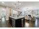 Open concept kitchen with granite island, stainless appliances and an easy flow into the living spaces at 2370 Burch Cir, Brookhaven, GA 30319