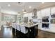 Gourmet kitchen with granite countertops, stainless steel appliances, and breakfast bar seating for four at 2370 Burch Cir, Brookhaven, GA 30319