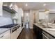 Modern kitchen features stainless steel appliances, granite countertops, and stylish range hood at 2370 Burch Cir, Brookhaven, GA 30319