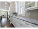 Bright kitchen features granite countertops, white cabinetry, and stainless steel appliances at 2370 Burch Cir, Brookhaven, GA 30319
