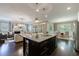 Open concept living space with granite island, view to dining and fireplace with custom mantle at 2370 Burch Cir, Brookhaven, GA 30319