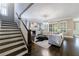 Bright living room showcasing a staircase, fireplace, and modern furnishings at 2370 Burch Cir, Brookhaven, GA 30319