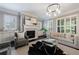Cozy living room features a fireplace, modern furnishings, and bright natural light at 2370 Burch Cir, Brookhaven, GA 30319