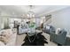 Open-concept living room features modern furnishings, a kitchen island, and an open staircase at 2370 Burch Cir, Brookhaven, GA 30319