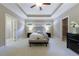 Spacious primary bedroom with tray ceiling, neutral paint, carpet, and ample natural light at 2370 Burch Cir, Brookhaven, GA 30319