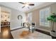 Home office with transparent desk, ceiling fan and a view of dining room at 2370 Burch Cir, Brookhaven, GA 30319